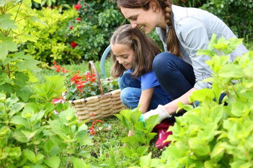 Inspector reviewing garden maintenance work with notes